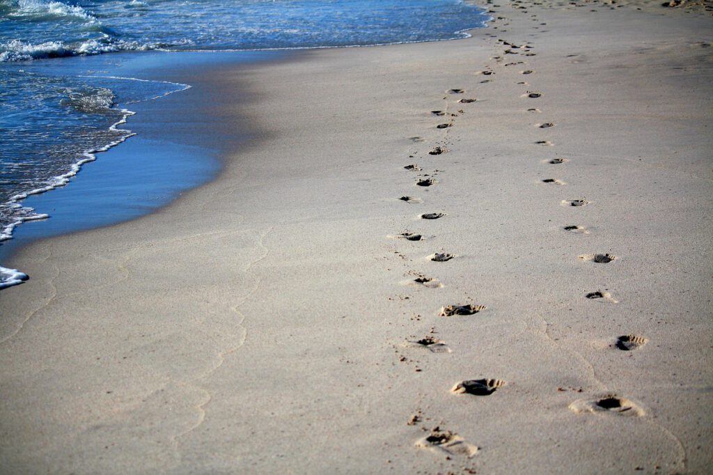 footprints, sand, sea