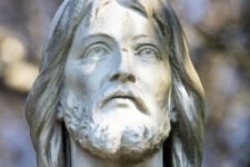 a close up of a statue of jesus